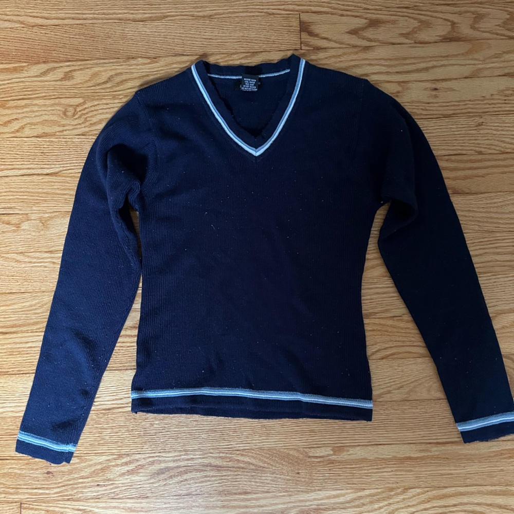 blue sweater, light blue and white trim